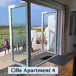 Cille Apartments, Village